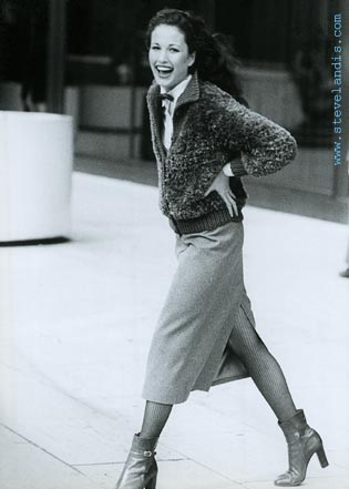early fashion photo of Andie MacDowell walking with smile