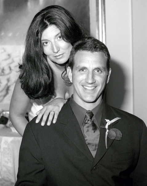 Newlyweds relaxing in a black and white artistic portrait at their New York City wedding reception