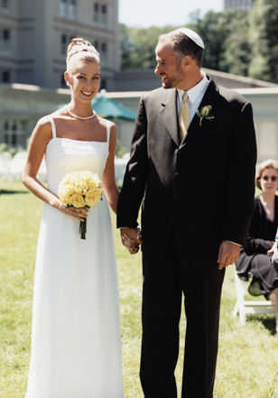 bride and groom walking during  outdoor New York wedding ceremony