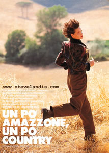 Silke running through wheat field in Tuscany, Italy, photographed by Steve Landis