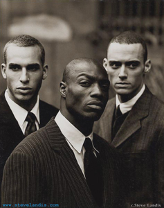 Wale with two bodyguards in black and white